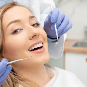 Woman,Having,Teeth,Examined,At,Dentists.,Teeth,Whitening,,Dental,Care caucasian woman getting teeth checked at the dentist