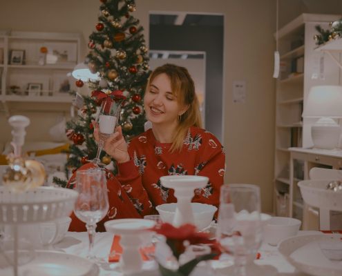woman enjoying christmas foods and smiling